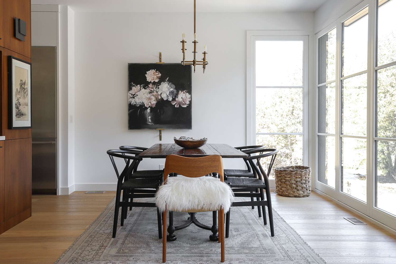 A dining room with a table and chairs